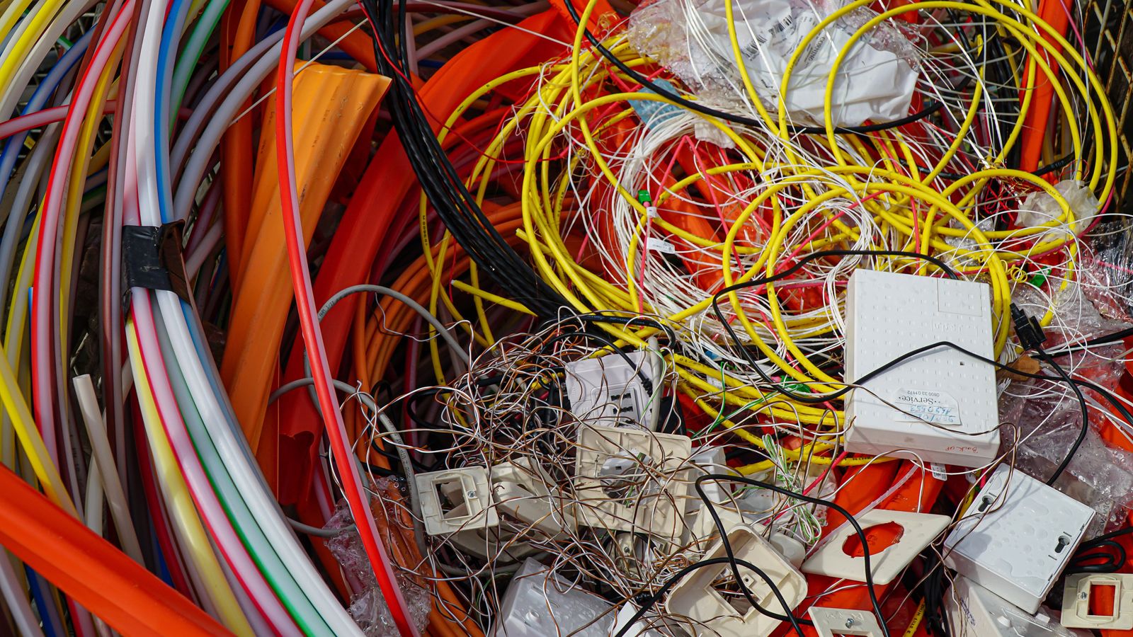 Colorful electrical cables and universal waste staged for recycling